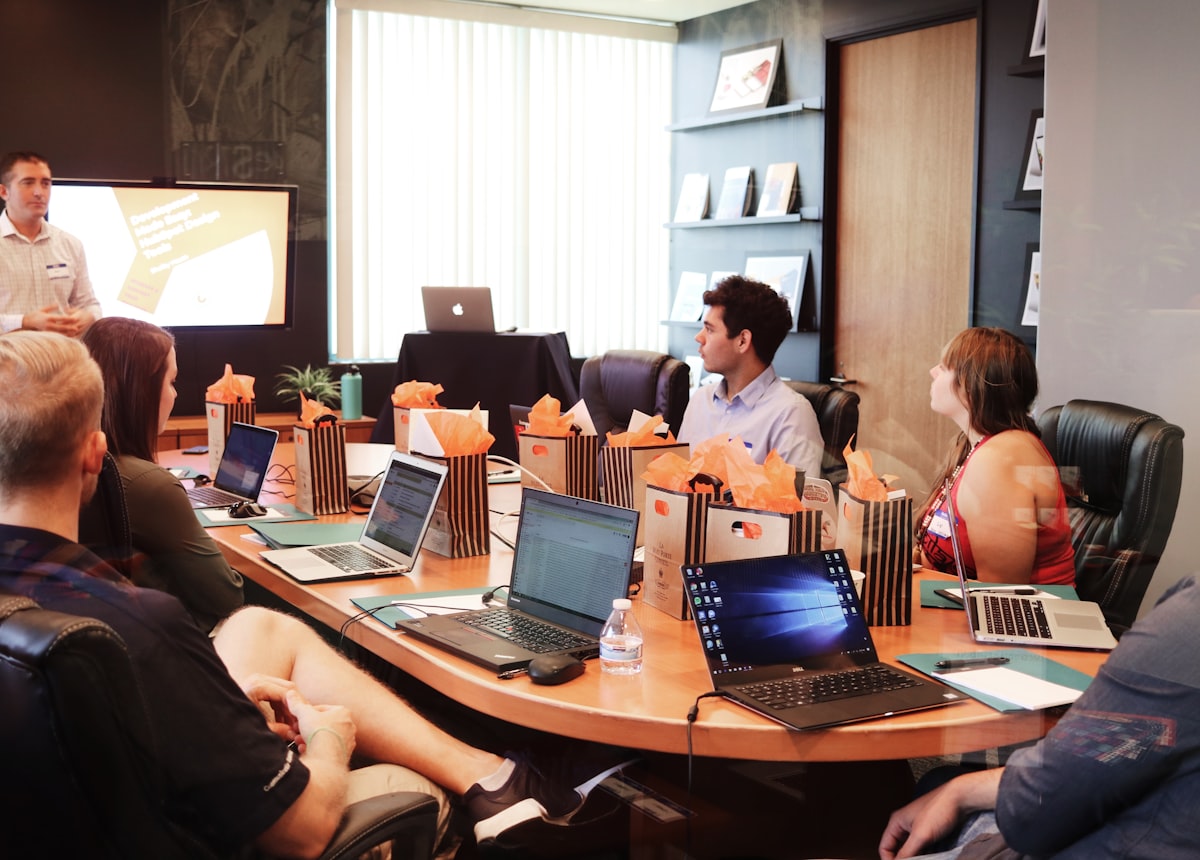 Consulting team working through technology plans around a table
